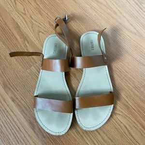 Brown double strap sandals.